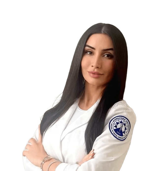 Dr.-Memarian-1920w A woman with long black hair wearing white and blue.