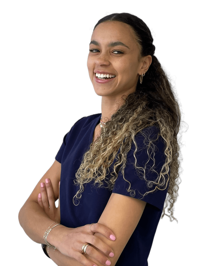 image-0a6a9d5e-a7ed5404-0a3a0dc3-1920w A woman with long hair standing in front of a green background.